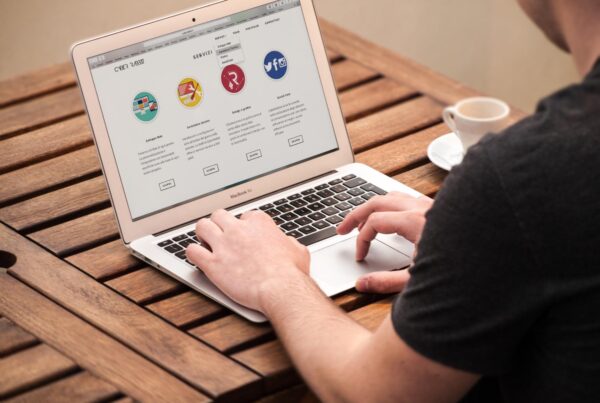Man working on laptop outdoors
